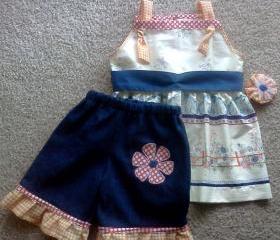 Denim Ruffle Shorts with a Sleeveless Blouse